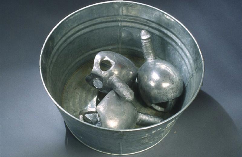 metal cast sculptures which look like men's cocks in a metal bucket